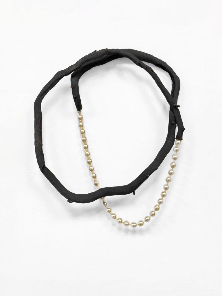 Henrik Strömberg Loop 02, 2026 cut out root system piece and part of repurposed pearl necklace 20 x 16 x 5 cm